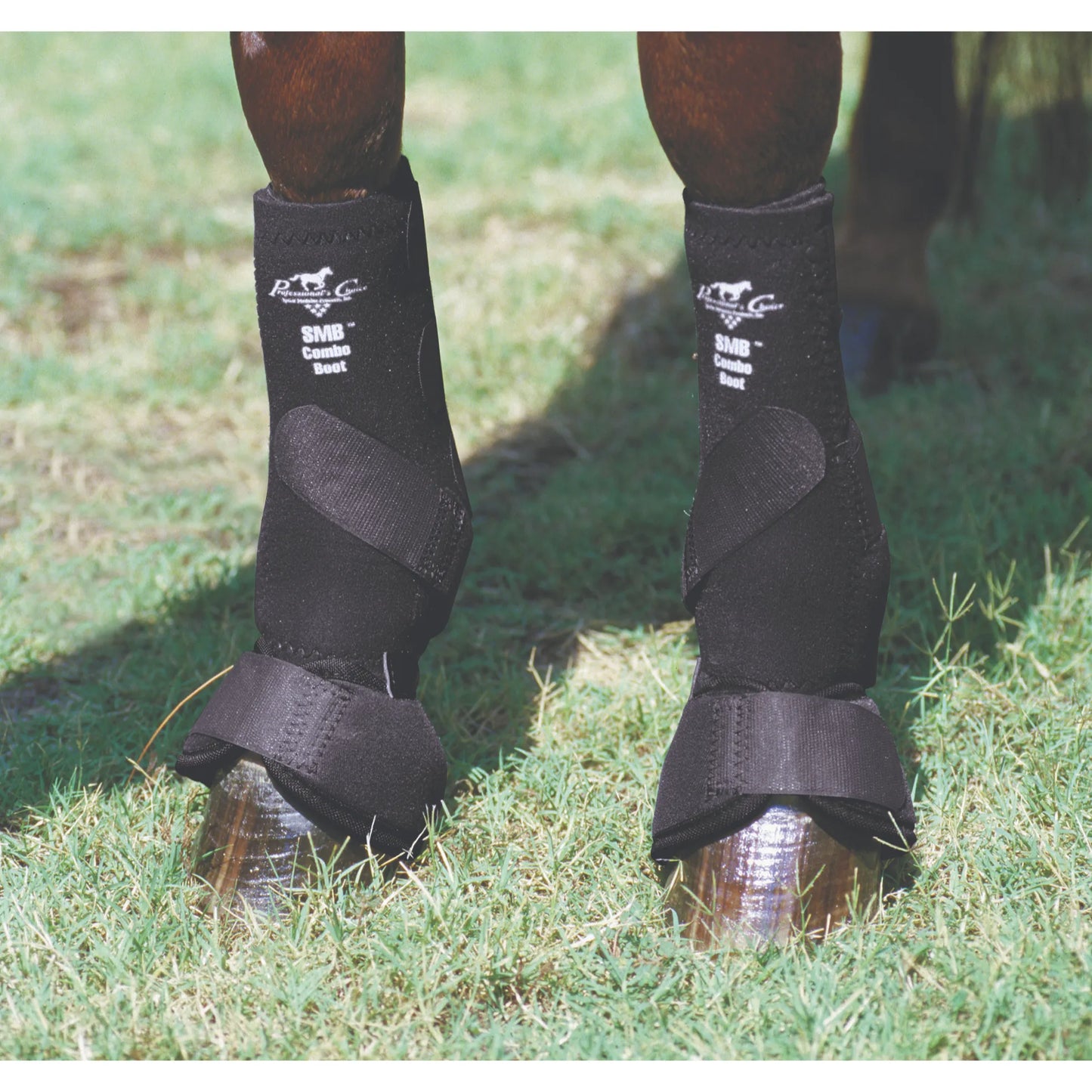 Professional's Choice SMB Combo Front Boots in black, providing all-in-one equine leg protection. These medium sports medicine boots feature an integrated bell boot to protect the fetlock and hoof during horse training or performance. Designed for shock absorption and durability, these professional-grade horse boots offer a secure fit with Velcro closures for maximum support. Ideal for equestrian gear collections and horse health maintenance.