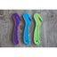 Professionals Choice Soft Touch Bale Cutters in vibrant purple, blue, and lime green. These ergonomic hay bale openers feature a recessed safety blade for protection and a soft-grip handle for comfort. A must-have barn tool for easily cutting twine and plastic wrap on hay bales, shown on a rustic gray wood background. Durable equestrian stable supplies perfect for daily farm chores and feed room organization.