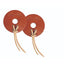 Professional's Choice Texas Leather Bit Guards in russet brown, designed for anti-rub protection and horse comfort. These circular leather bit guards feature a center hole and sturdy cream leather ties for easy attachment to horse bits. Ideal for preventing pinching and chafing, this high-quality horse tack is perfect for western riding enthusiasts looking for durable, functional, and stylish equestrian gear.