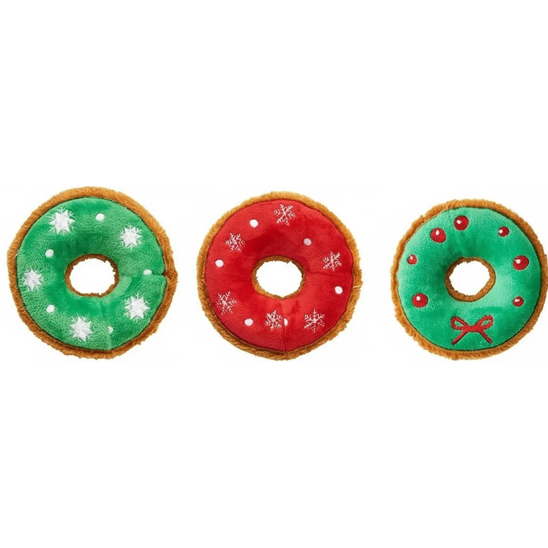 Set of three festive holiday plush donut dog toys from Ethical Pet SPOT. These 5.5-inch squeaky toys feature soft, colorful icing: one green with white snowflakes, one red with white snowflakes, and one green wreath design with red berries and a bow. Each plush toy has a fuzzy brown crust, making them the perfect festive Christmas gift for your pup to squeak and snuggle.