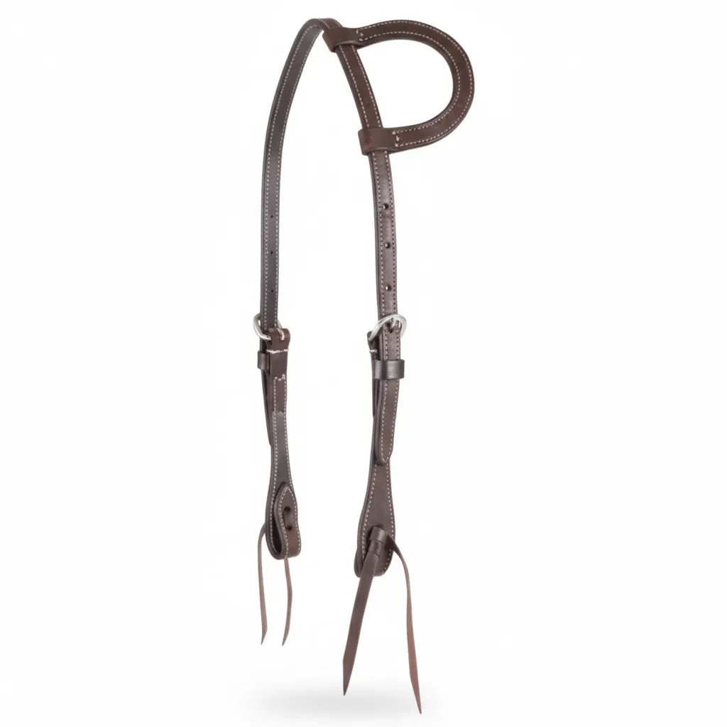 Martin Saddlery Slip Ear Headstall in premium dark brown roughout leather. This professional western horse headstall features a single slip ear design, decorative white contrast stitching, and heavy-duty stainless steel buckles. Designed with tie-bit ends for easy bit changes. A durable and stylish piece of equestrian tack perfect for training, performance, or everyday riding.