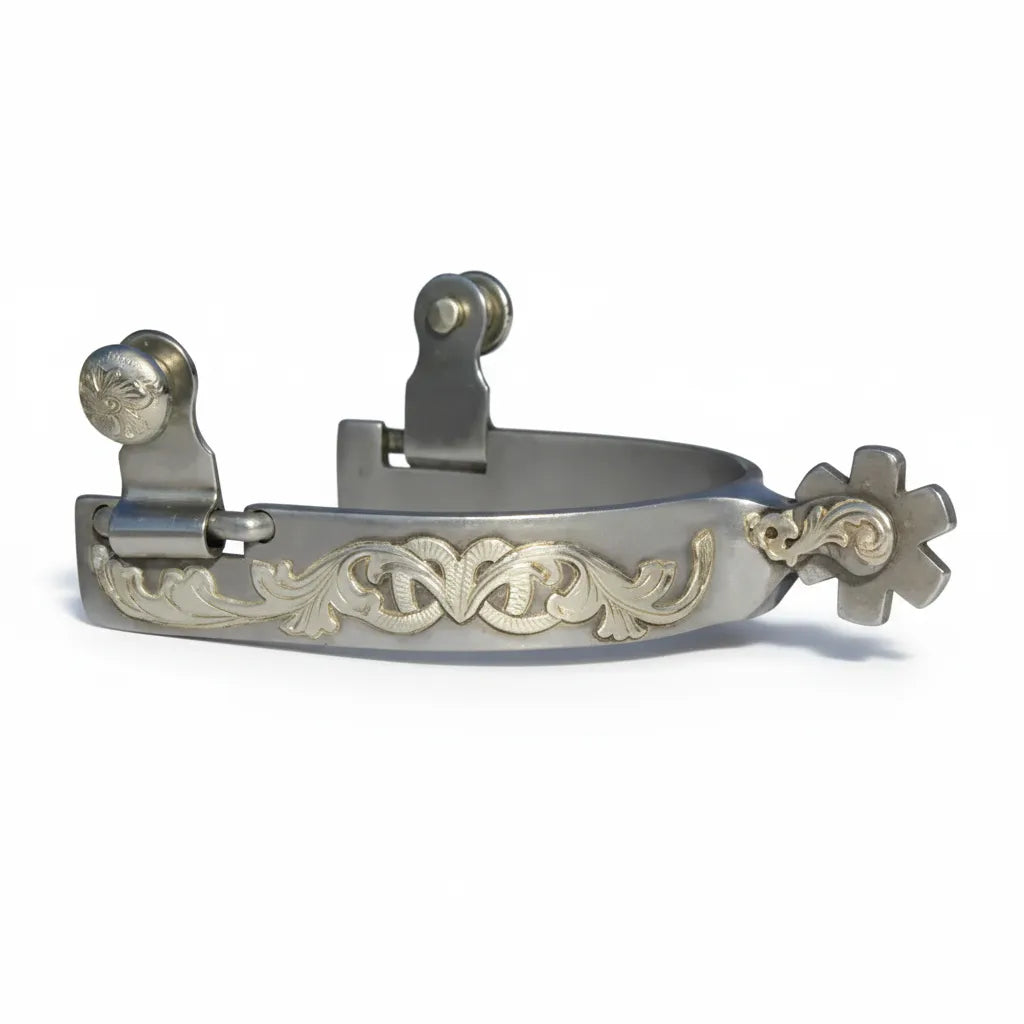 Professional's Choice Bob Avila Floral Engraved Short Shank Western Spurs featuring a 3/4" polished steel band with intricate gold-toned scrollwork. Designed with a short 1 1/4" shank and a 6-point rowel for precise cues. Premium horse riding gear with swing buttons for leather straps, perfect for western performance, shows, or daily training. Elevate your equestrian style with these expertly crafted, durable western spurs.