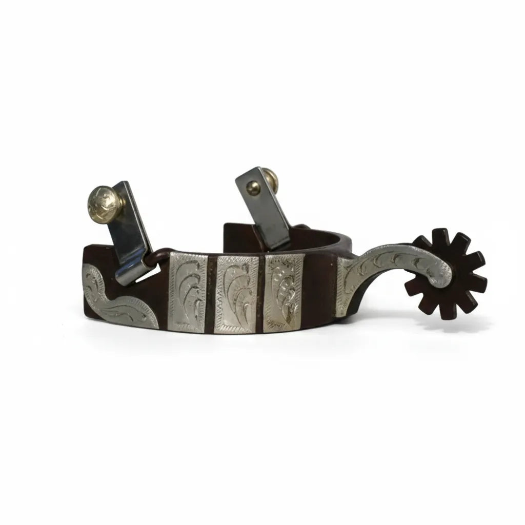 Professional's Choice Medium Shank Horse Spurs featuring a 1-inch dark brown band with elegant silver-toned floral overlays and engraving. These western equestrian spurs include a decorative engraved shank and a brown multi-point rowel. Designed for precision and style, these durable spurs are perfect for western pleasure, training, or ranch work, making them a must-have addition to any rider's horse tack collection.