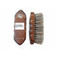 Professional's Choice Wood Series Small Horsehair Finishing Brush featuring a dark-stained Paulownia wood handle with a silver horse logo and ergonomic side grips. This high-quality equestrian grooming tool shows a side profile of dense, natural horsehair bristles designed for a polished show-ring finish. Lightweight and durable, it's an essential finishing brush for any horse grooming kit to add shine and remove fine dust.