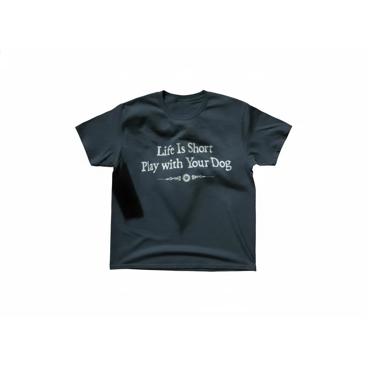 Dark blue unisex cotton t-shirt featuring the inspirational phrase "Life Is Short Play with Your Dog" in a white, whimsical font. A decorative scrollwork graphic with a central paw print sits below the text. This stylish and comfortable crew neck tee is a must-have for dog lovers and pet owners. Ideal for casual daily wear or as a thoughtful gift for any proud pet parent looking for high-quality dog-themed apparel.