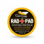 Super Snouts RAD + PAD Soothing Paw Balm for dogs, featuring a circular yellow and black label with a red cross logo. This handmade, USA-made healing treatment provides relief for cracked paws, minor wounds, and hot spots. Ideal for dog paw care and natural pet skincare, the 2oz tin displays a stylized dog icon and highlights its multi-use formula for canine skin repair and protection.