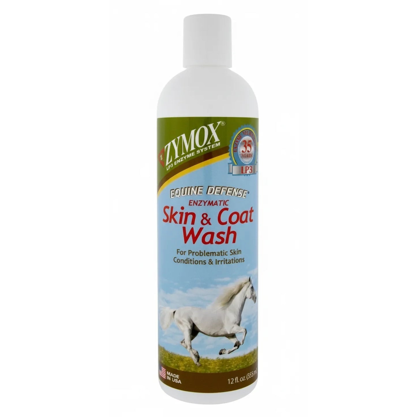Zymox Equine Defense Enzymatic Skin and Coat Wash for horses, 12 oz white bottle. This antimicrobial itch relief formula helps manage horse skin conditions and irritations using the patented LP3 Enzyme System. The label features a majestic white horse galloping through a sunny field under a blue sky. Ideal for equine grooming, soothing sensitive skin, and maintaining a healthy, shiny coat. Made in the USA.