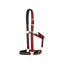 Black and red striped Weaver Equine Breakaway Halter featuring a padded crown and noseband for horse comfort. Designed with durable gold-colored brass hardware, an adjustable chin strap, and a safety leather breakaway fuse. This stylish equestrian horse halter provides a secure, adjustable fit for safety in the stable or field.