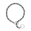 Weaver Leather Laced Chain Slip Collar for dogs, featuring a durable silver metal chain intricately woven with black and grey leather lacing. This stylish and functional dog training collar is designed to provide a quieter, more comfortable experience during walks. The slip-style design includes large, high-quality metal rings for smooth action and easy lead attachment. Perfect for heavy-duty use, professional dog training, and controlled walking.