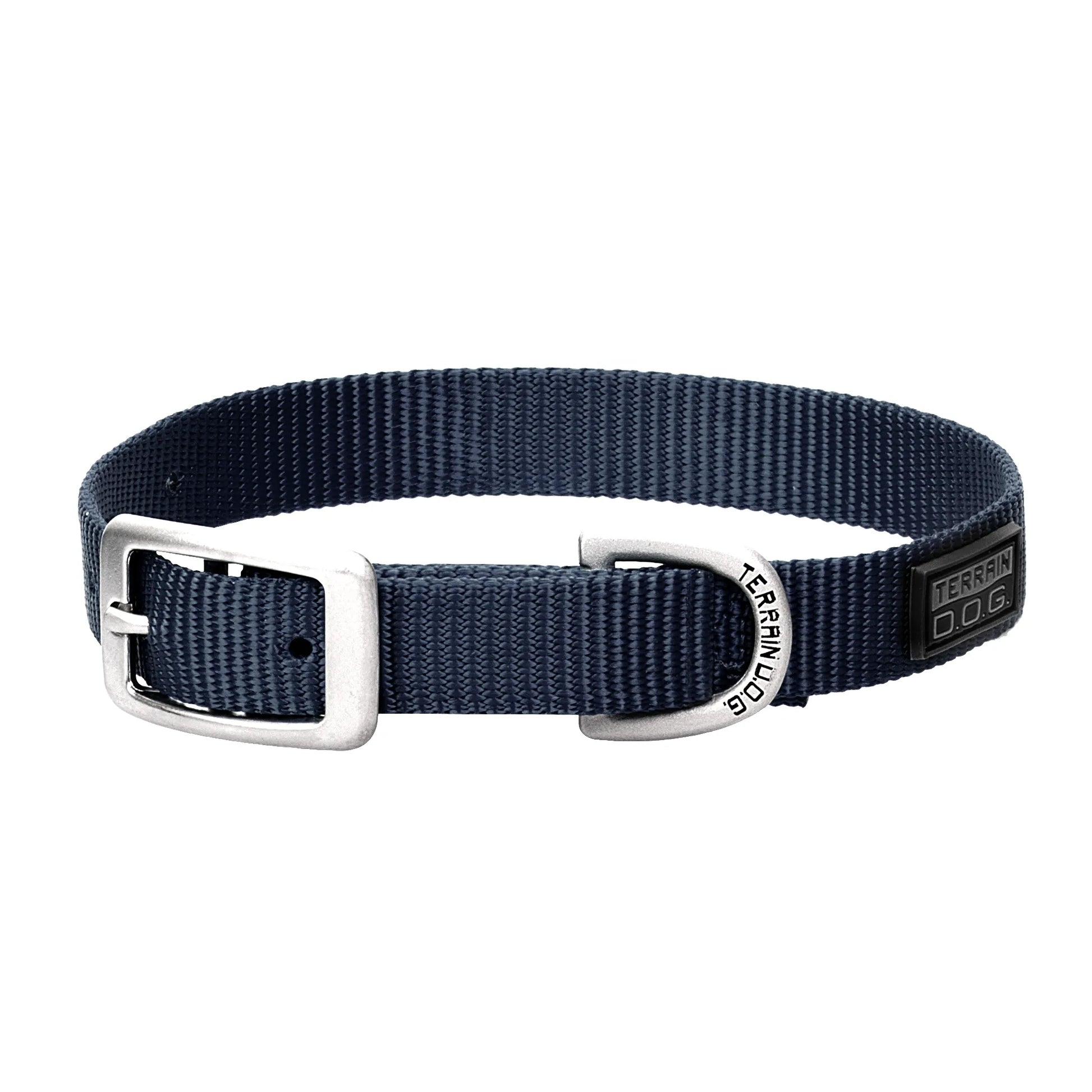 Navy blue Weaver Leather Nylon Dog Collar featuring durable, heavy-duty webbing, a classic silver-tone buckle, and a sturdy D-ring engraved with the Terrain D.O.G. logo. This stylish and adjustable pet collar includes a black rubber branded patch, making it a reliable and rugged choice for your pup's outdoor adventures and daily walks.