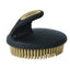 Weaver Leather Palm Curry comb in black with tan rubber bristles. This ergonomic horse grooming brush features a comfortable palm-fit handle and flexible teeth designed for effective shedding and massaging. A must-have for any equestrian grooming kit, it easily removes dirt and loose hair to promote a shiny, healthy coat. Durable and high-quality tool for daily equine care and coat maintenance.