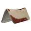 Weaver Leather Synergy Contoured Saddle Pad in natural wool felt with premium brown leather accents. This high-performance western horse pad features an anatomical spine for a perfect fit and shock-absorbing wool for ultimate horse comfort. Detailed with durable wear leathers and the Synergy by Weaver logo, it's a stylish and functional choice for trail riding and performance horses.