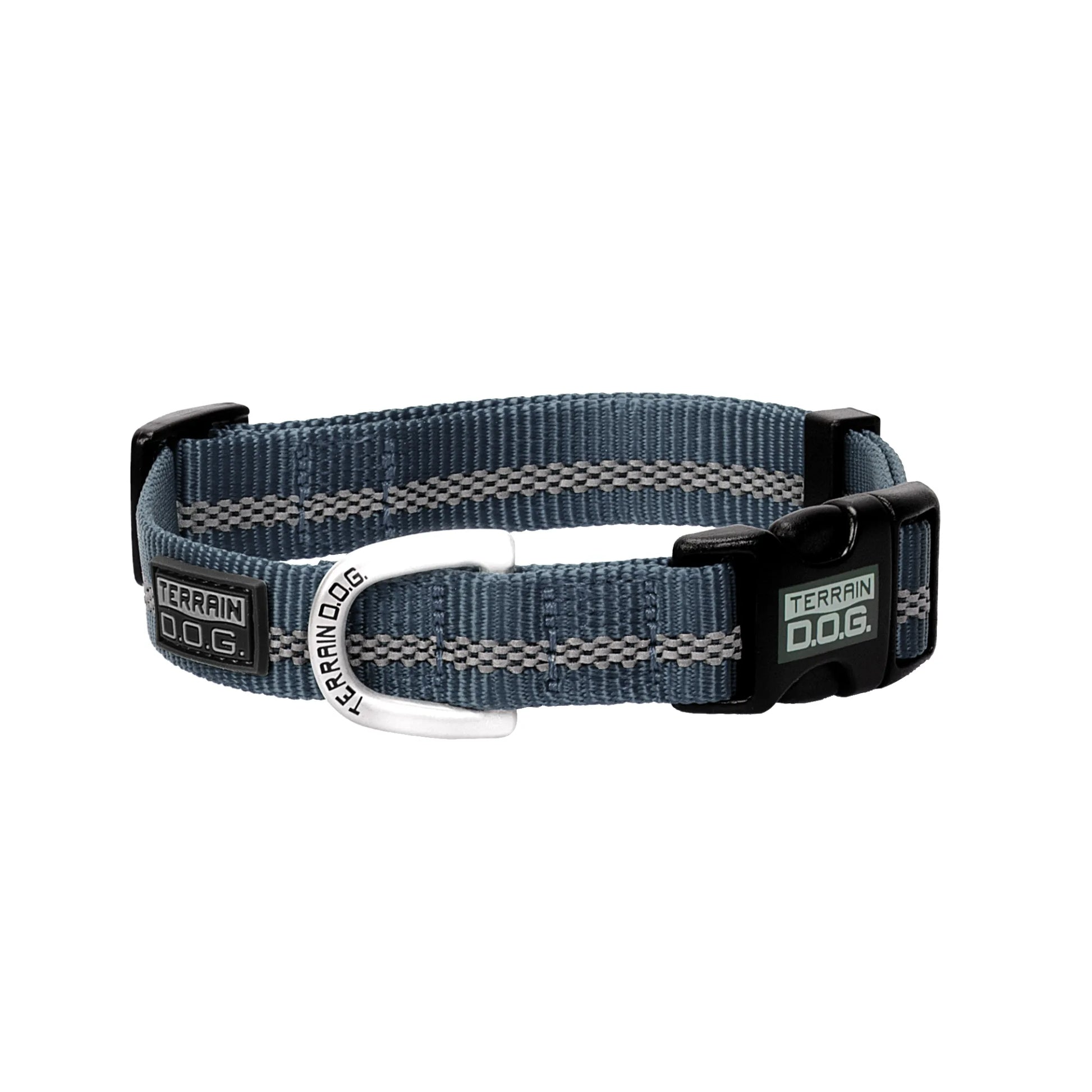 Weaver Leather Terrain D.O.G. Reflective Snap-n-Go Collar in slate blue nylon with dual grey reflective safety stripes. This adjustable dog collar features a black quick-release buckle and a sturdy silver D-ring engraved with the Terrain D.O.G. logo. Designed for both safety and style, it's the perfect gear for high-visibility night walks and rugged outdoor adventures with your canine companion.