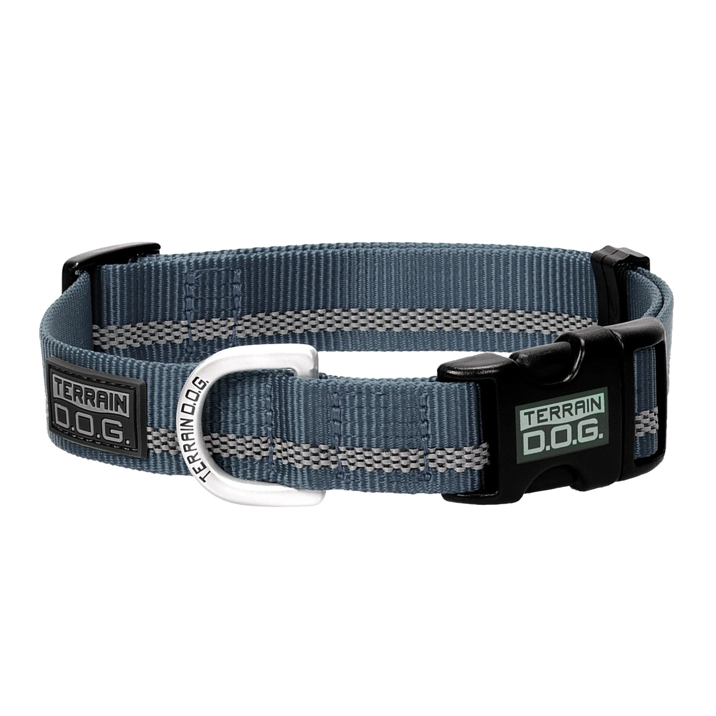 Weaver Leather Terrain D.O.G. Reflective Snap-n-Go dog collar in steel blue with a high-visibility grey reflective stripe. Features durable nylon webbing, a black side-release buckle for easy use, and an engraved silver metal D-ring. This stylish, adjustable safety collar is ideal for active dogs, nighttime walks, and rugged outdoor adventures.