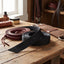 Weaver Leather black nylon half breed billet coiled on a tack room bench