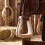 Weaver Leather rawhide covered roper stirrup hanging from a western saddle fender